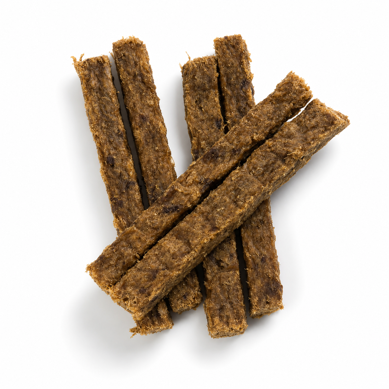 Sechs längliche Entenfleisch-Riegel liegen leicht überlappend auf einem weißen Hintergrund. Die getrockneten Hundesnacks besitzen eine feste, faserige Struktur und werden durch weiche, natürliche Schatten hervorgehoben.